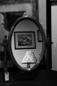 shabby interior lamp and photo on wall