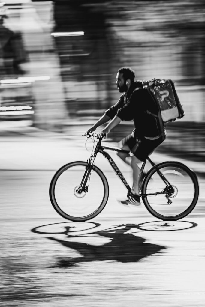 dynamic black and white cyclist in motion