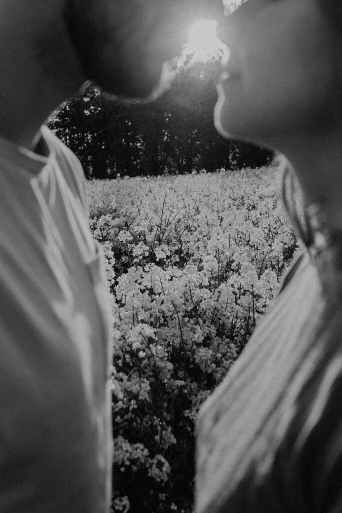 black and white photo of a couple standing face to face