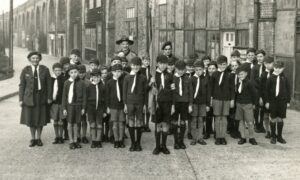 grayscale photo of young scouts