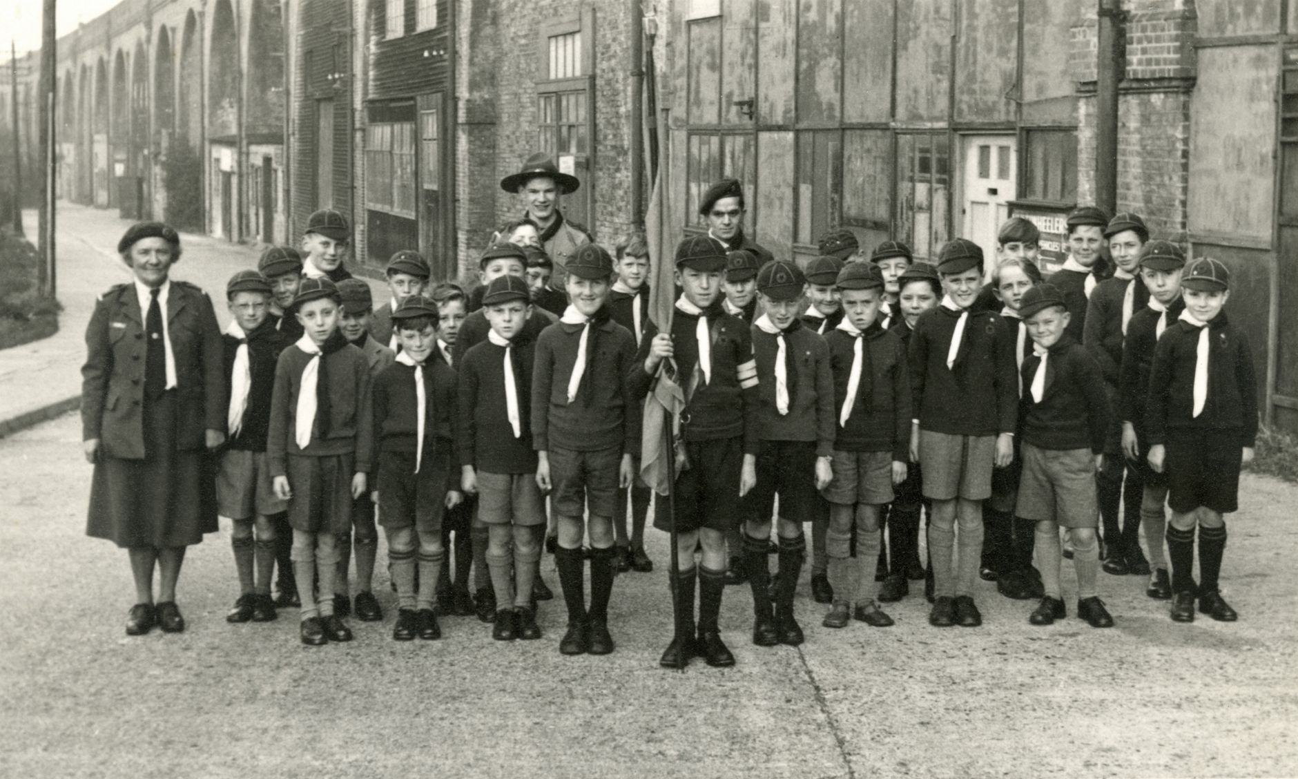 grayscale photo of young scouts